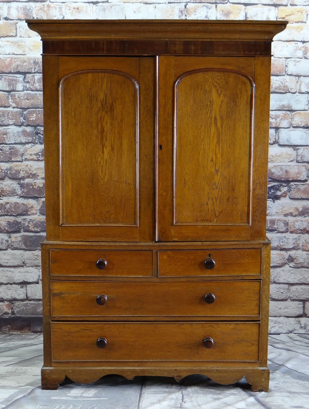 VICTORIAN OAK & MAHOGANY LINEN PRESS, ogee cornice and plain frieze above arched panelled doors,