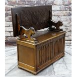 REPRODUCTION OAK MONK'S BENCH with lion arm supports, shield carved top and linen fold front, 106cms