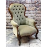 VICTORIAN WALNUT BALLOON BACK ARMCHAIR, button upholstered in olive green velour, scrolled back