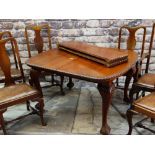 VICTORIAN STYLE EXTENDING DINING TABLE and SEVEN CHAIRS, with gadroon moulded top and leaf capped