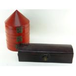 TWO CHINESE LACQUERED RED BOXES, comprising a triple tiered hat box, 46cms high, and a narrow dome-