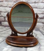 LATE VICTORIAN WALNUT OVAL DRESSING TABLE MIRROR with carved foliate supports and oval box base,