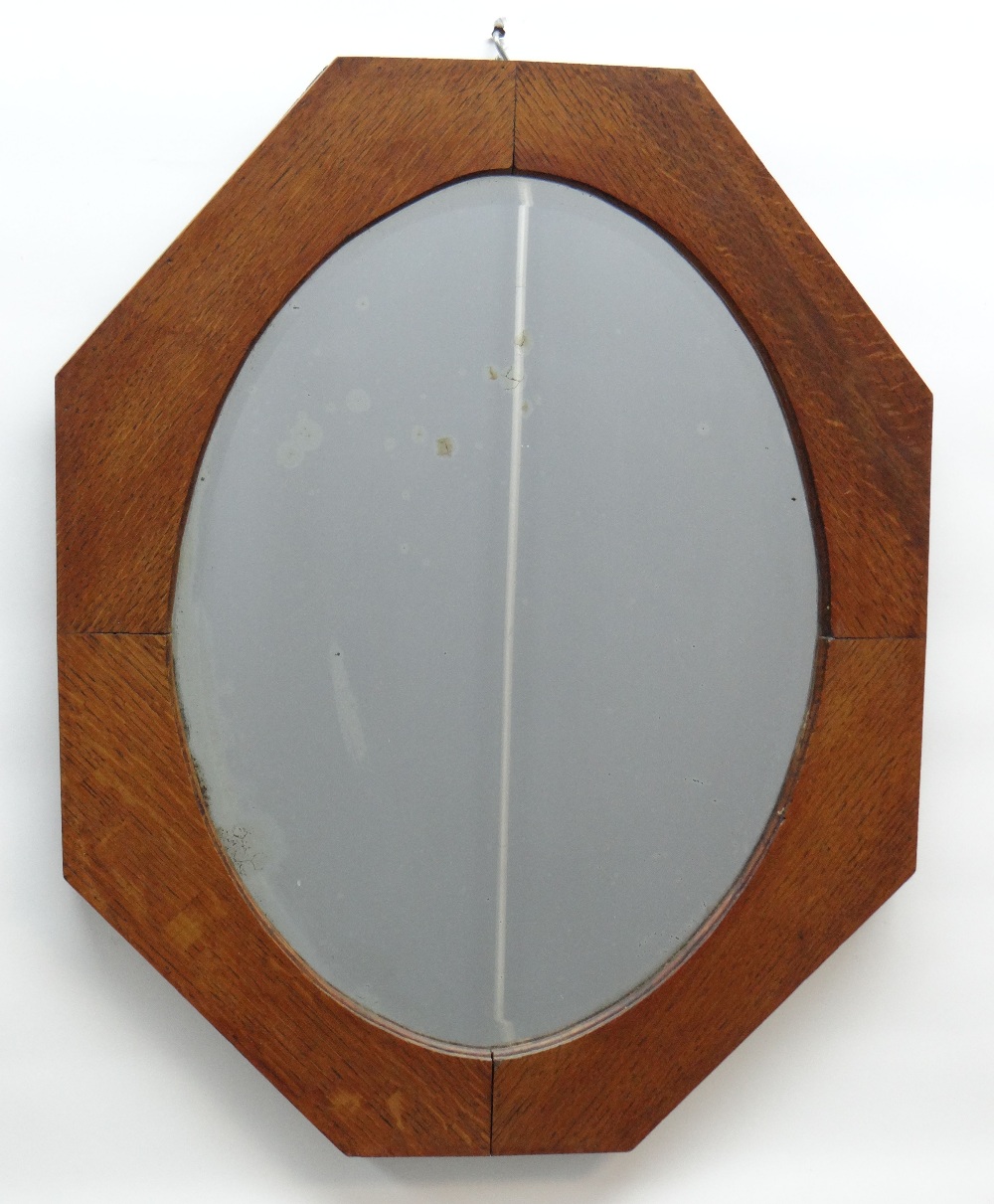 ARTS & CRAFTS-STYLE OAK MIRROR, octagonal; with oval plate, 74.5cm high