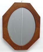 ARTS & CRAFTS-STYLE OAK MIRROR, octagonal; with oval plate, 74.5cm high