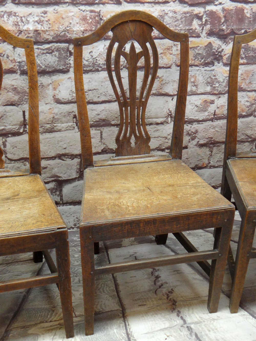 SET OF FOUR EARLY 19TH CENTURY OAK SIDE CHAIRS with pierced vase splats, tapering solid seats and - Image 2 of 3