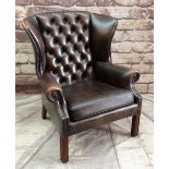 A MODERN REPRODUCTION GEORGIAN-STYLE WING-BACK LEATHER ARMCHAIR, brown button upholstered and