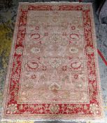 OUSHAK RUG, allover floral salmon field within dark pink palmette border and narrow guards, 275 x