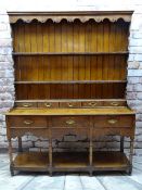 GEORGE III WELSH OAK DRESSER, boarded delft rack with scalloped frieze, integral bank of five