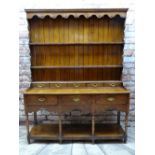 GEORGE III WELSH OAK DRESSER, boarded delft rack with scalloped frieze, integral bank of five