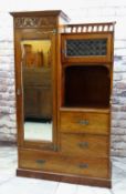 ARTS & CRAFTS-STYLE MAHOGANY WARDROBE / COMPACTUM, with mirrored door, floral carved frieze, gilt