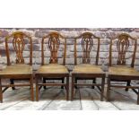 SET OF FOUR EARLY 19TH CENTURY OAK SIDE CHAIRS with pierced vase splats, tapering solid seats and