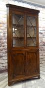 19TH CENTURY OAK STANDING CORNER CABINET, angled cornice with mahogany frieze, astragal glazed