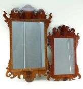 TWO GEORGIAN-STYLE MAHOGANY FRET MIRRORS, each with shaped cornice and corner flanges, 80cms and