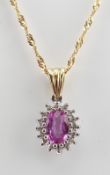 18CT GOLD SET PINK SAPPHIRE & DIAMOND PENDANT on 9ct gold fine spiral chain, 3.4gms Condition