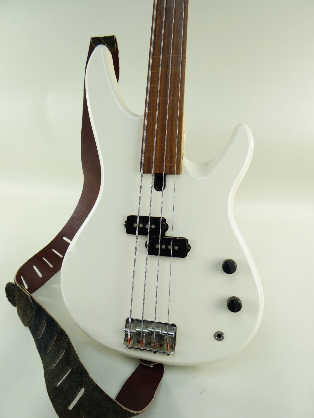 YAMAHA FRETLESS BASS GUITAR, model RBX250F, off-white finish with inlaid line fretboard, 113cms long