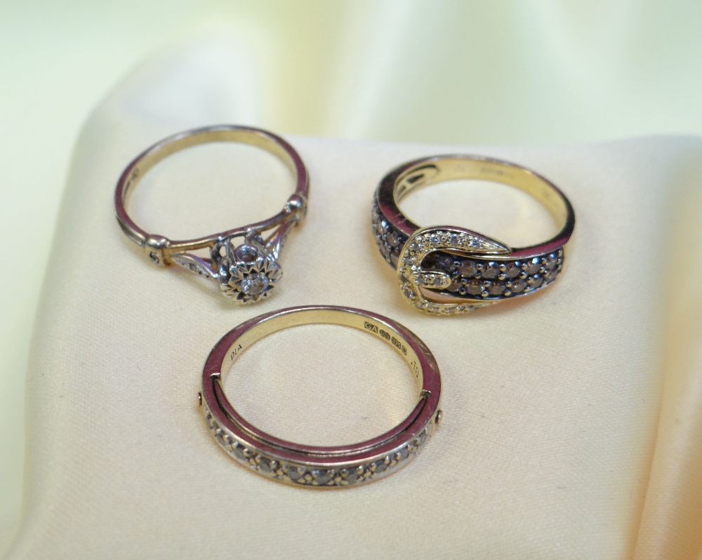 GOLD RINGS comprising 14k gold buckle design diamond set ring, 9ct gold diamond half eternity 'I
