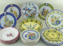 ASSORTED FRENCH QUIMPER FAIENCE DISHES, including floral and figurative painted plates and serving