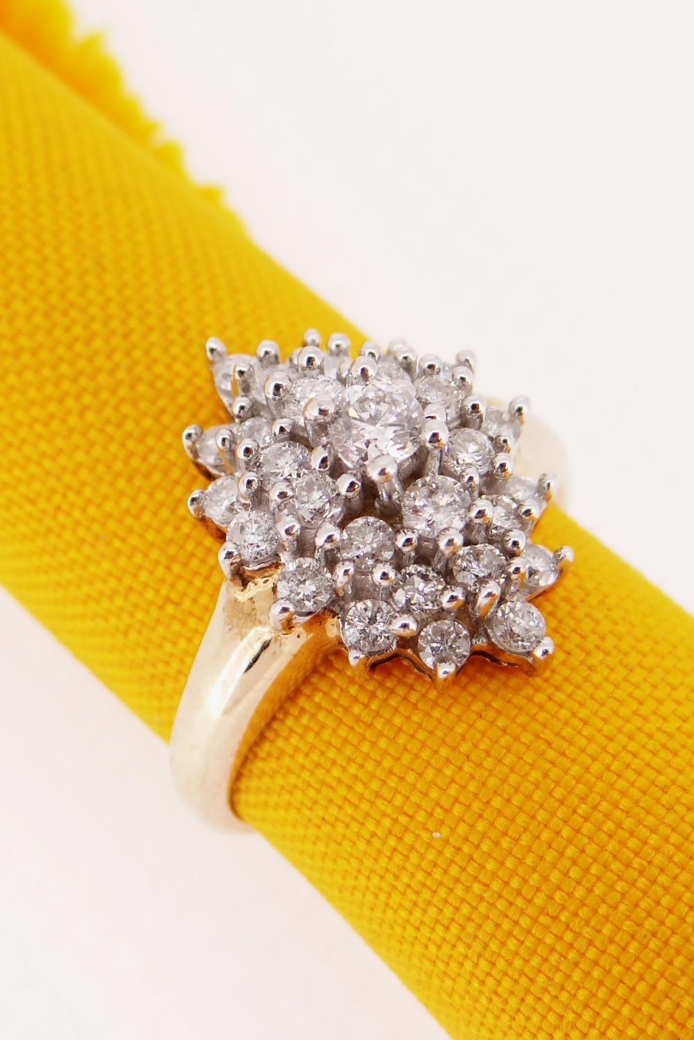 9CT GOLD DIAMOND CLUSTER RING, made up of twenty-nine graduated diamonds, ring size N / O, 4.8gms