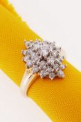 9CT GOLD DIAMOND CLUSTER RING, made up of twenty-nine graduated diamonds, ring size N / O, 4.8gms