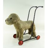 BBC BARGAIN HUNT LOT: VINTAGE MERRYTHOUGHT GREY PUSH ALONG DOG, on original painted metal frame,