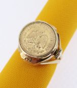 18K GOLD EMKA COIN SET RING WATCH, the hinged lid set with coin marked 'Estados Unidos Mexicanos'