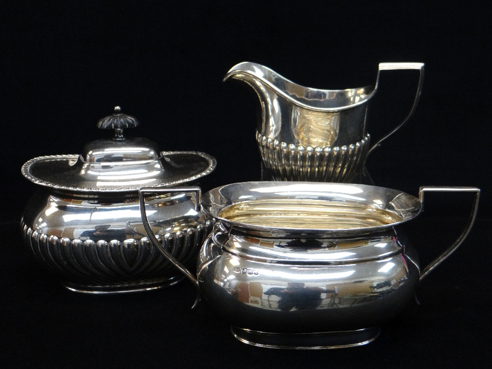 SILVER MILK JUG, SILVER SUGAR BASIN and PLATED TEA CADDY, fluted jug Chester 1919, plain basin