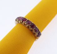 9CT GOLD SEVEN STONE RUBY RING, ring size M, 2.4gms, in W Grant of York jewellery ring box