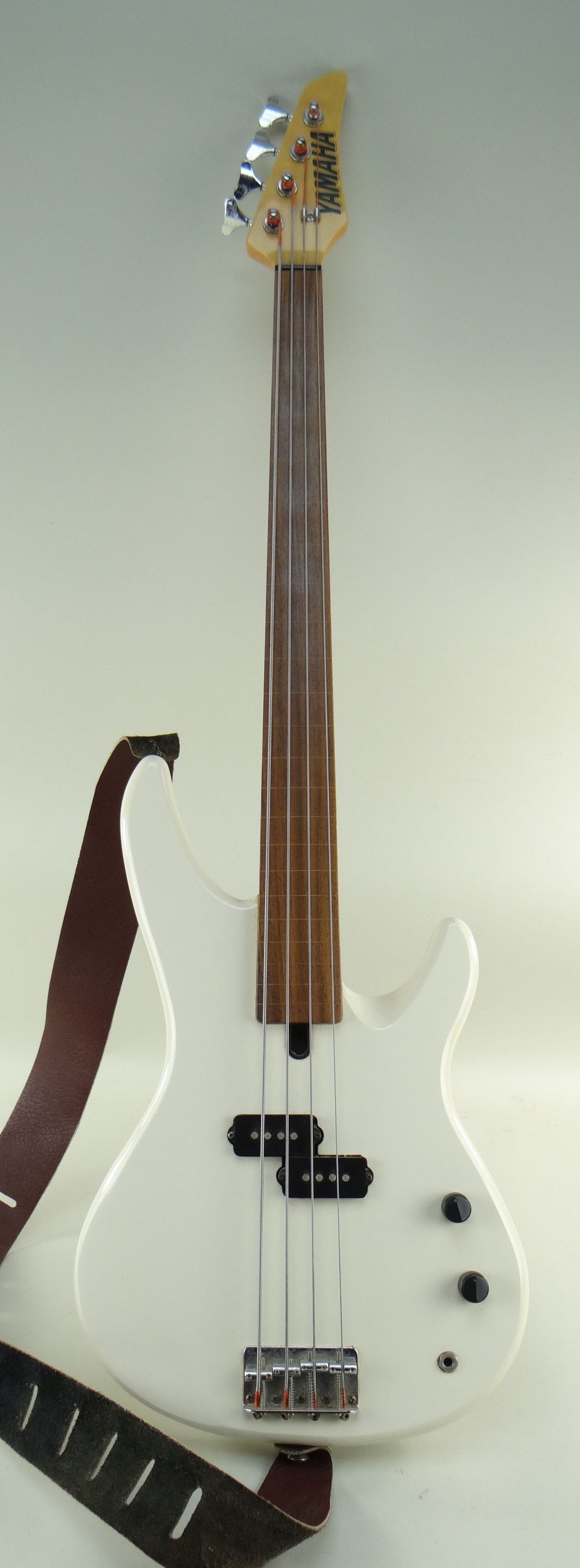 YAMAHA FRETLESS BASS GUITAR, model RBX250F, off-white finish with inlaid line fretboard, 113cms long - Image 4 of 5