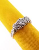 18CT GOLD & PLATINUM THREE STONE DIAMOND RING, the illusion set diamonds 0.16ct overall