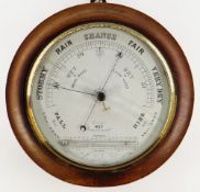 LATE VICTORIAN WALNUT ANEROID BAROMETER, circular double scalloped case and brass bezel enclosing