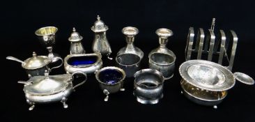 ASSORTED SILVER TABLE WARES, including cruet, pair dwarf candlesticks, egg cup, tea strainer,