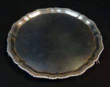 GEORGE VI SILVER SALVER raised on three ball and claw feet, pie crust gadroon border, London 1939,