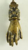 BBC BARGAIN HUNT LOT: VICTORIAN BRASS HAND DOOR KNOCKER, hand holding a fruit, 15cms long