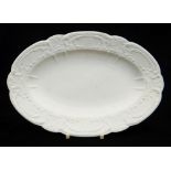 NANTGARW PORCELAIN UNGLAZED & NON DECORATED OVAL DISH typically moulded with c-scrolls, ribbons