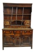 A SMALL CHARACTERFUL OAK NORTH WALES CUPBOARD-BASE WELSH DRESSER circa 1770-1800 having a base of