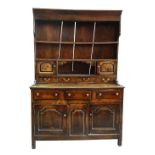 A SMALL CHARACTERFUL OAK NORTH WALES CUPBOARD-BASE WELSH DRESSER circa 1770-1800 having a base of