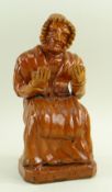 A RARE 19TH CENTURY SLIPWARE POTTERY MODEL OF AN OLD WELSH LADY IN COSTUME attributed to Pill