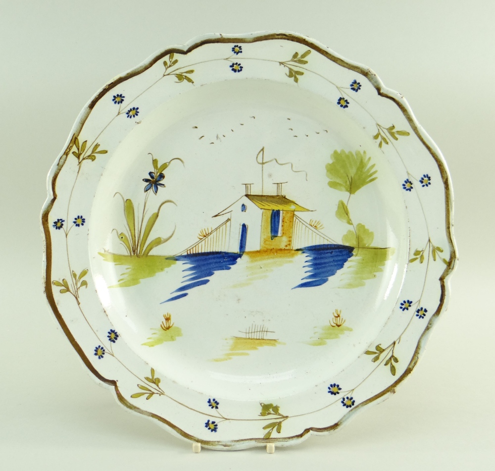 A SWANSEA POTTERY 1802-1810 PEARLWARE CHARGER DISH of lobed form, the interior painted in deep blue,