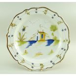 A SWANSEA POTTERY 1802-1810 PEARLWARE CHARGER DISH of lobed form, the interior painted in deep blue,