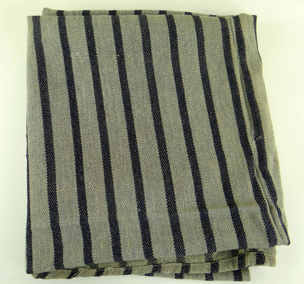 A TWO SECTION JOINED HEAVY WEIGHT ANTIQUE WELSH BLANKET having narrow dark blue flecked stripes