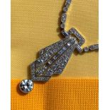 ART DECO DIAMOND ENCRUSTED PENDANT ON CHAIN, having diamond drop (1.0ct approx.) below the pierced