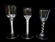 THREE GEORGIAN WINE GLASSES, comprising a single series air twist cable wine with rounded funnel