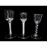 THREE GEORGIAN WINE GLASSES, comprising a single series air twist cable wine with rounded funnel