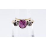 18CT GOLD PINK SAPPHIRE & DIAMOND RING, the central pink sapphire (6 x 5mms approx.) flanked by