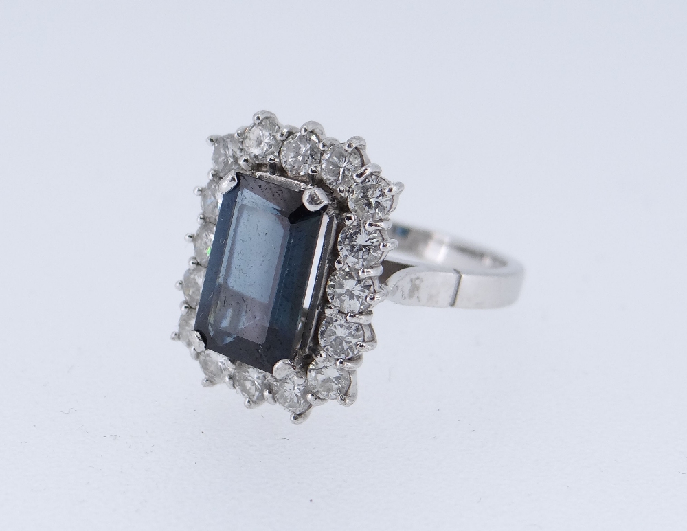 18CT WHITE GOLD SAPPHIRE & DIAMOND CLUSTER RING, the central sapphire (10 x 6mms) surrounded by - Image 2 of 3