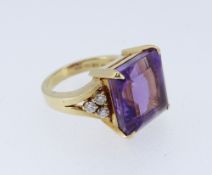 18CT GOLD AMETHYST & DIAMOND DRESS RING, the large square cut amethyst (12 x 12mms) flanked by a