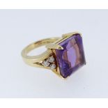 18CT GOLD AMETHYST & DIAMOND DRESS RING, the large square cut amethyst (12 x 12mms) flanked by a