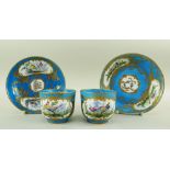 TWO SEVRES-STYLE PORCELAIN BLEU CELESTE TEA CUPS AND SAUCERS, 19th Century or later, decorated