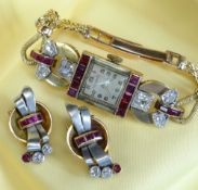 YELLOW METAL DIAMOND & RUBY SET COCKTAIL WATCH, the dial marked 'A E C Watch', set with a border