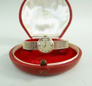 OMEGA 9CT GOLD LADIES WRISTWATCH having integrated 9ct gold strap, the inner back cover marked '